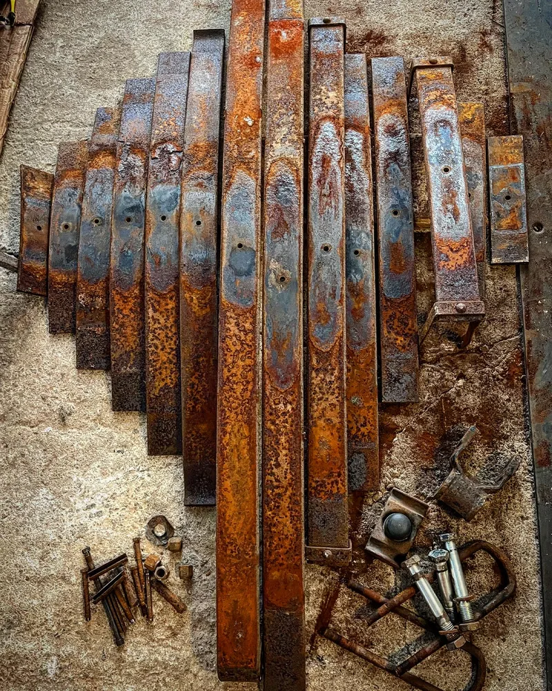 Rusty truck leaf springs in pieces