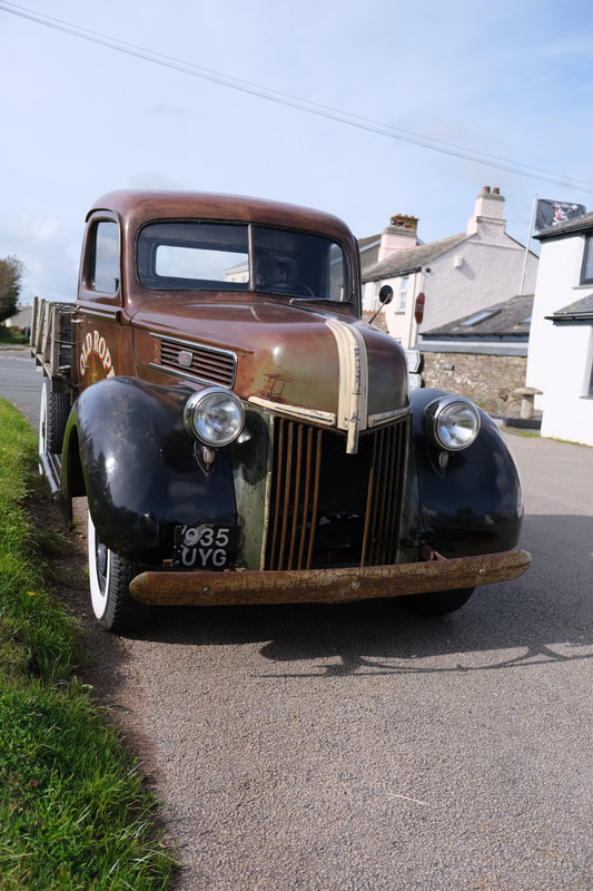 1941 Old Rope Salvage Ford truck parked in Cornwall village