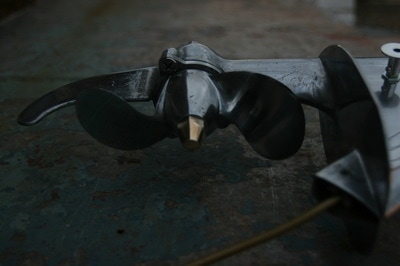 Upcycled outboard motor wall light