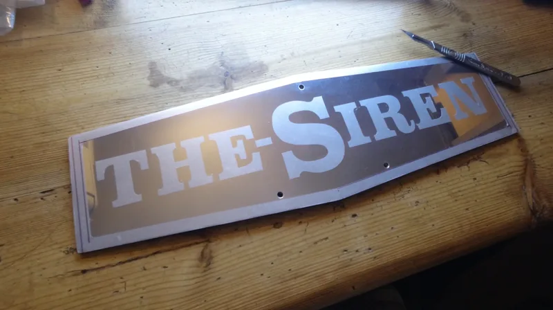 Metal Name Badge ‘The Siren’ made using DIY electro etching in a salt bath 