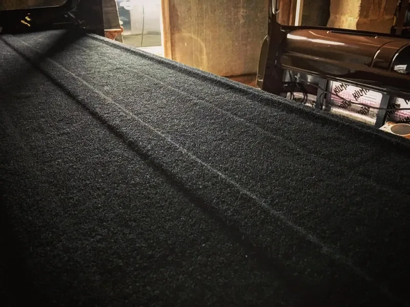 Black carpet inside the cab of a Bedford truck