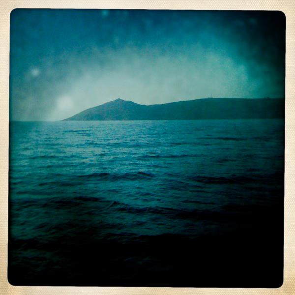 A photograph taken from a boat of the Cornish landmark, Rame Head